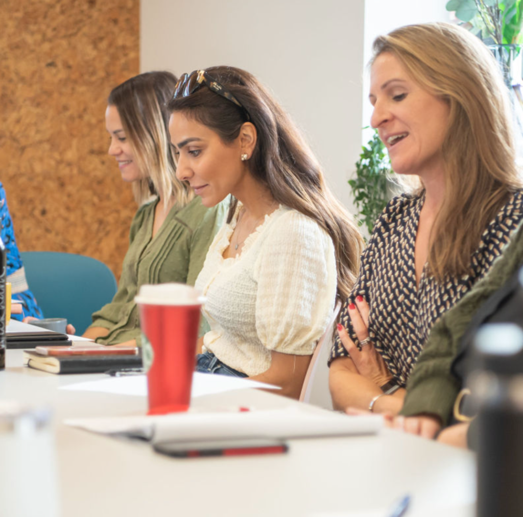Female founders in conversation at a Six Figured Females meet-up